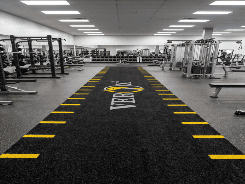 cleaning gym turf with specialized solution